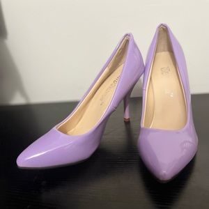 Purple high heel pumps